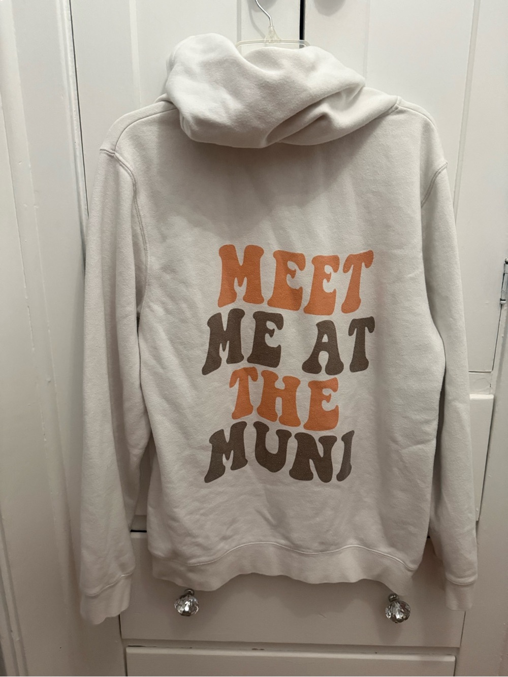 Cream Graphic Pullover Hoodie with Orange & Brown Lettering